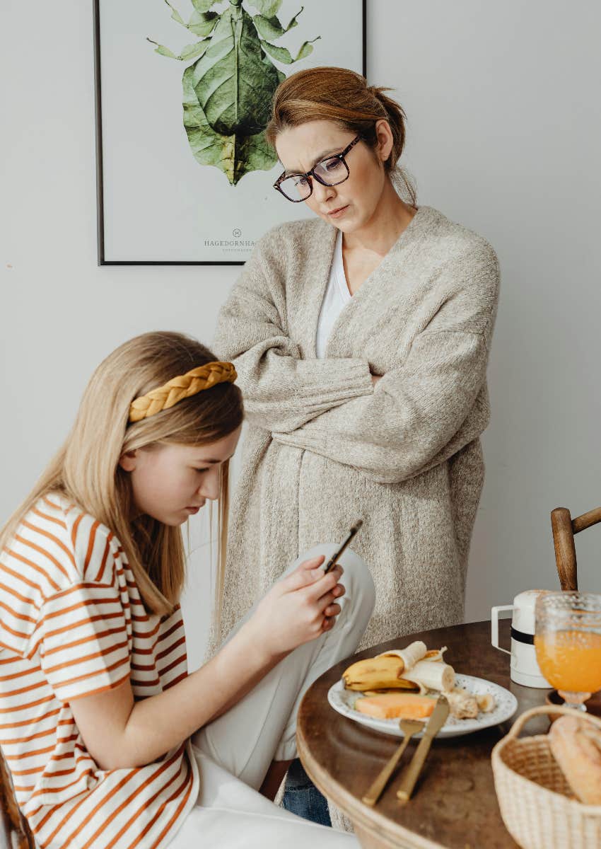 woman with bad attitude towards kids who is annoyed with her daughter