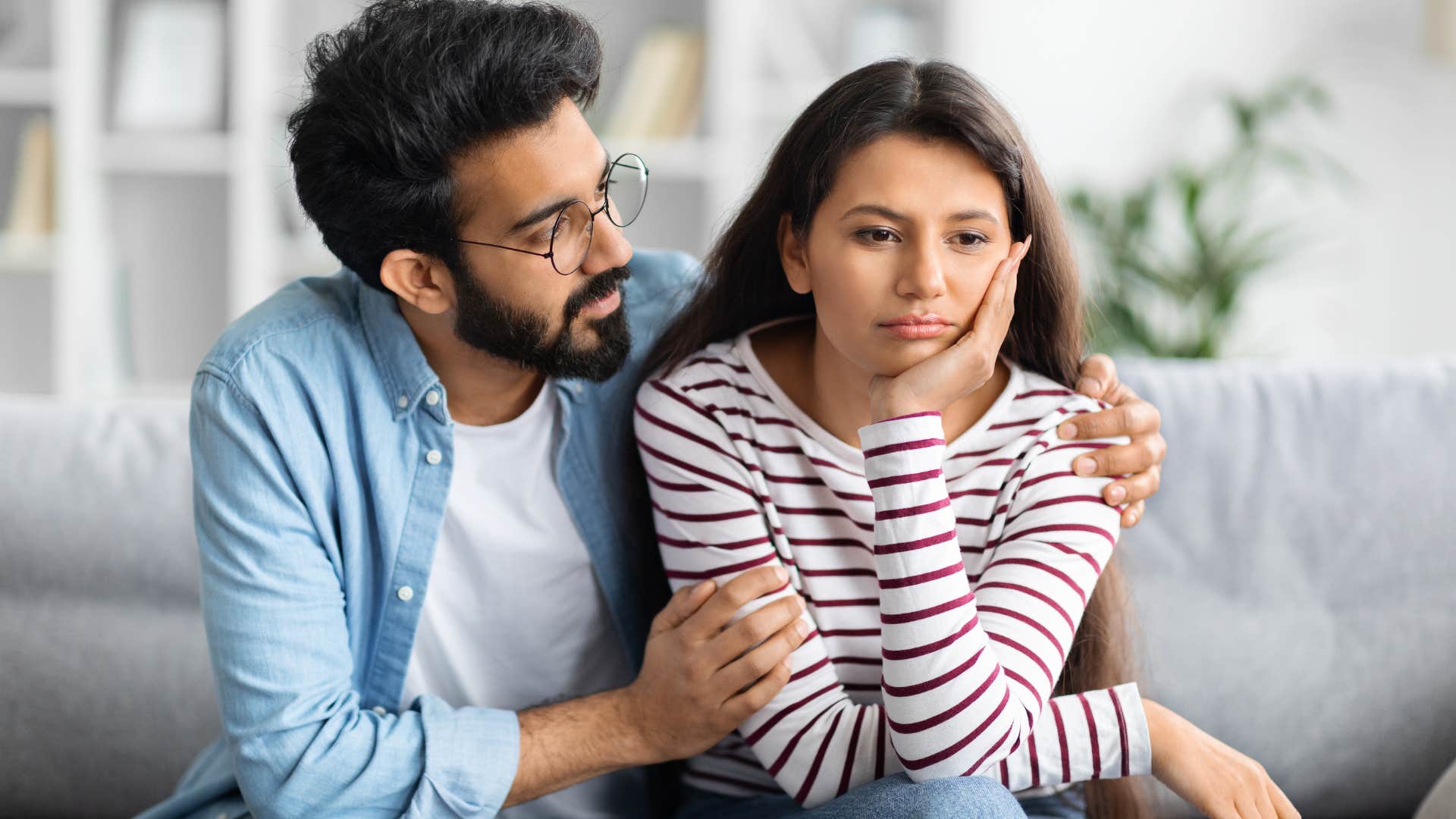 woman playing the victim as man comforts her