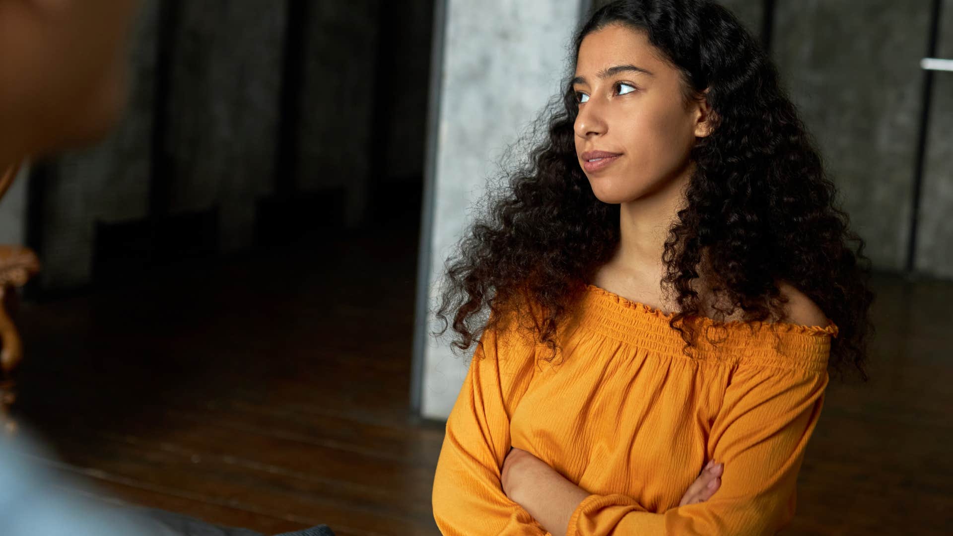 rude woman feeling full of herself with arms crossed