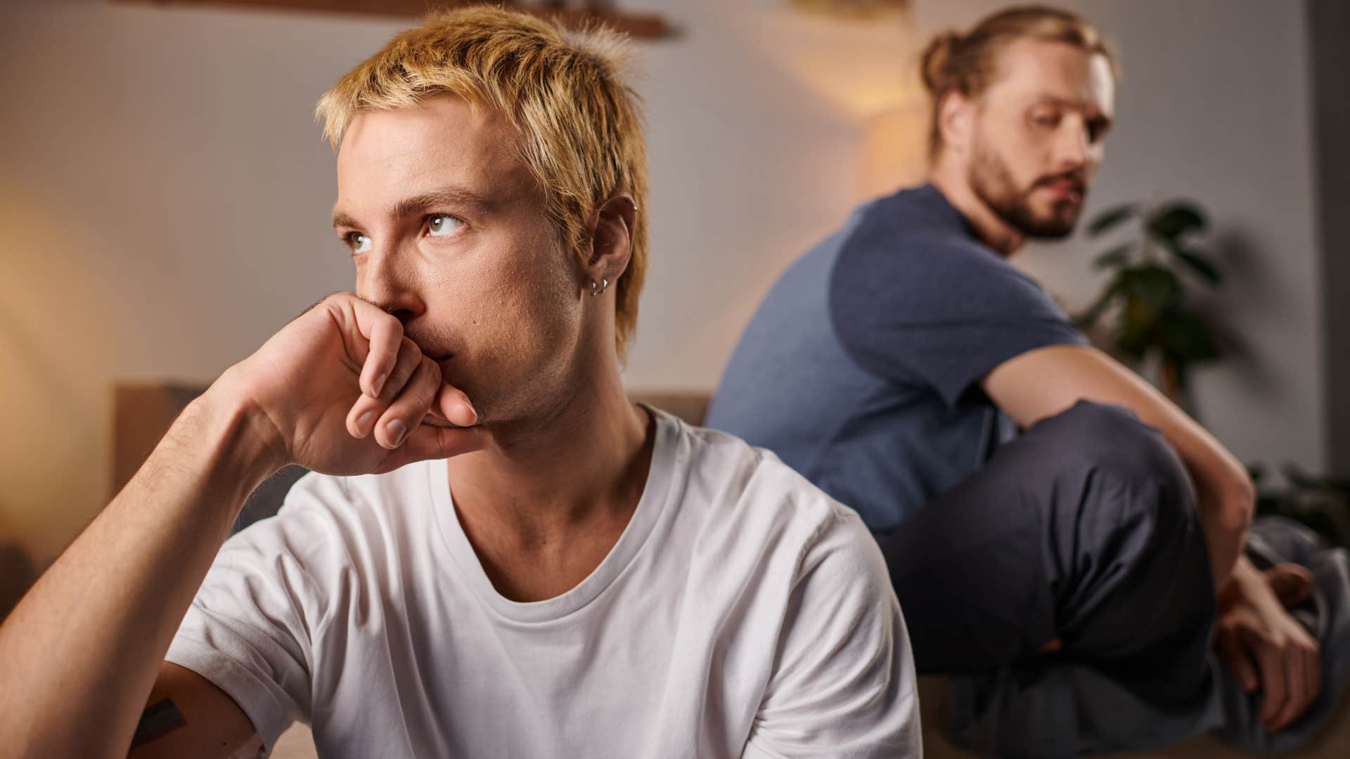 rude man turned away from emotionally hurt partner