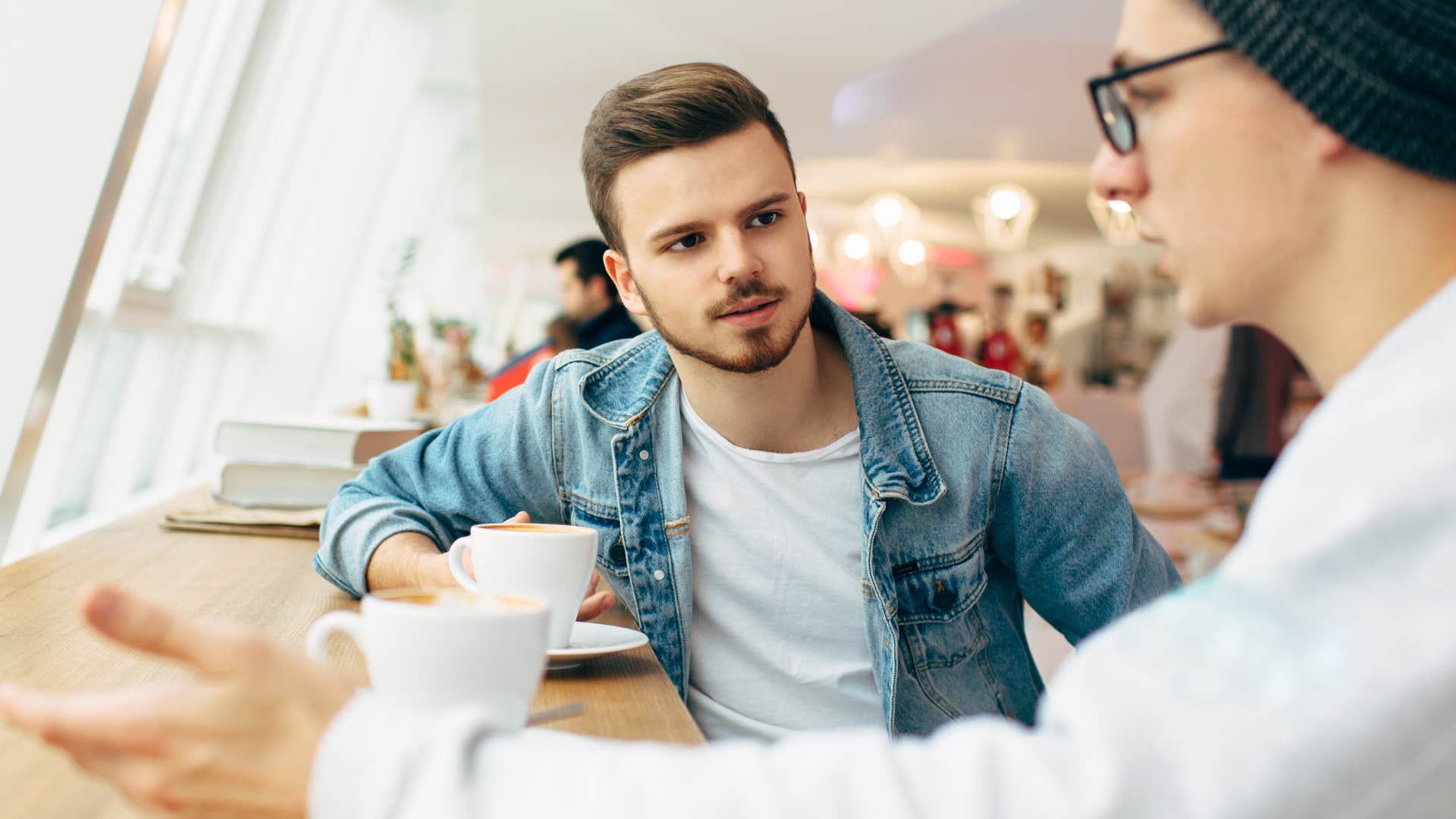 rude man shaming friend over coffee