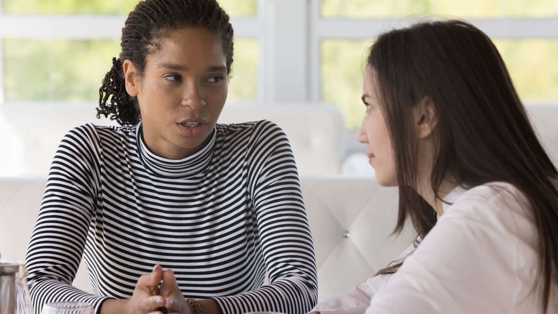 woman pointing out flaws of her peer