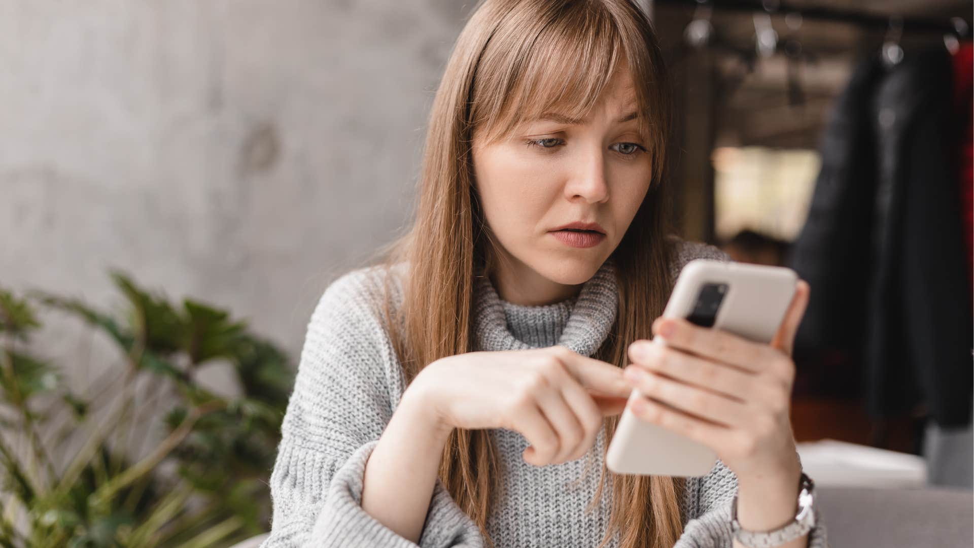 nervous woman canceling plans through text