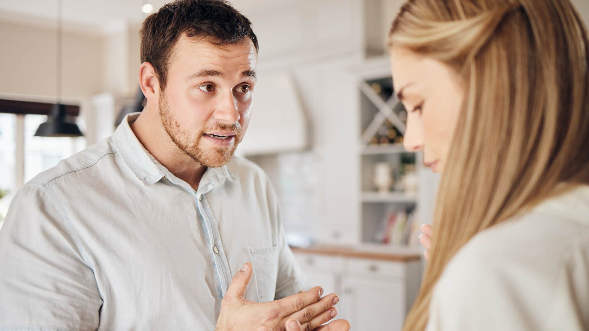 irritable man arguing with a woman