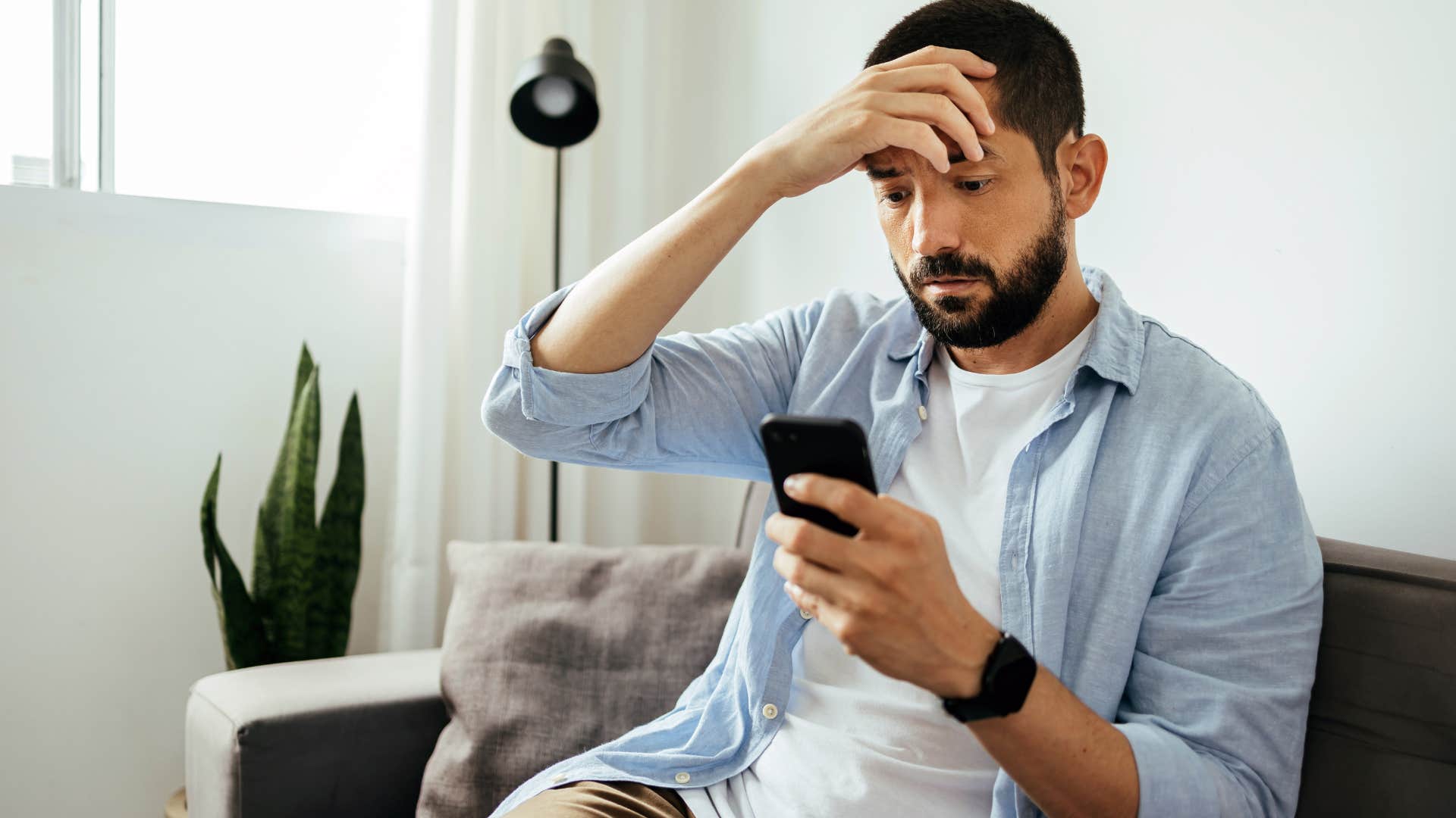 nervous man not responding to texts on phone