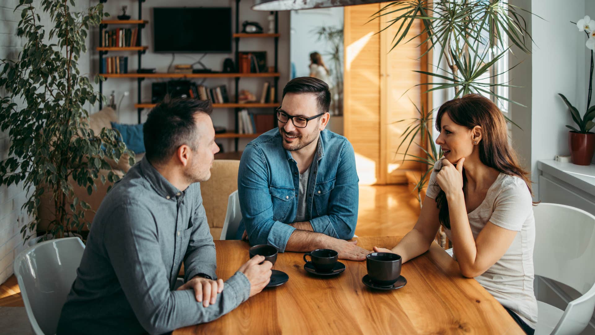 group of friends sitting around table Being quiet