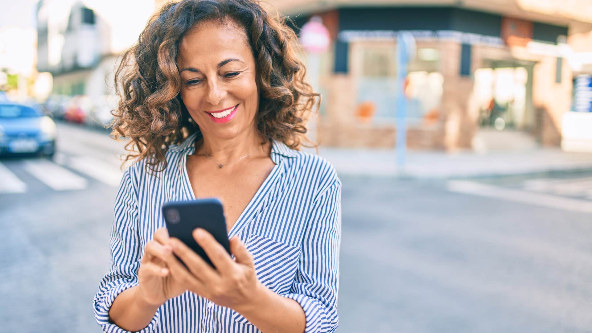 woman texting in street slow to respond to texts