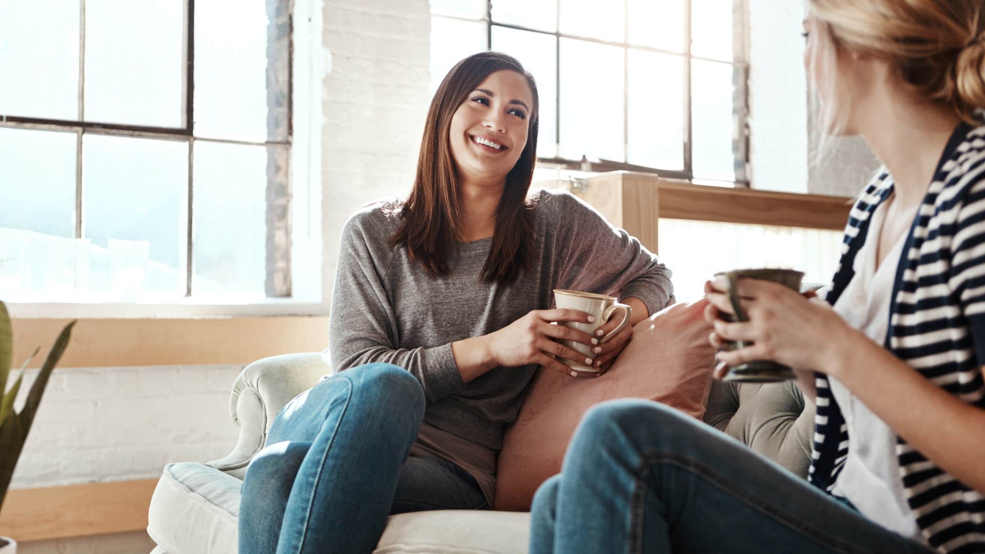 woman talking to friend on couch Not offering unsolicited advice or opinions