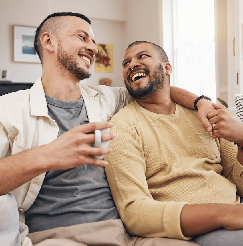 Close couple authentically smile while chatting