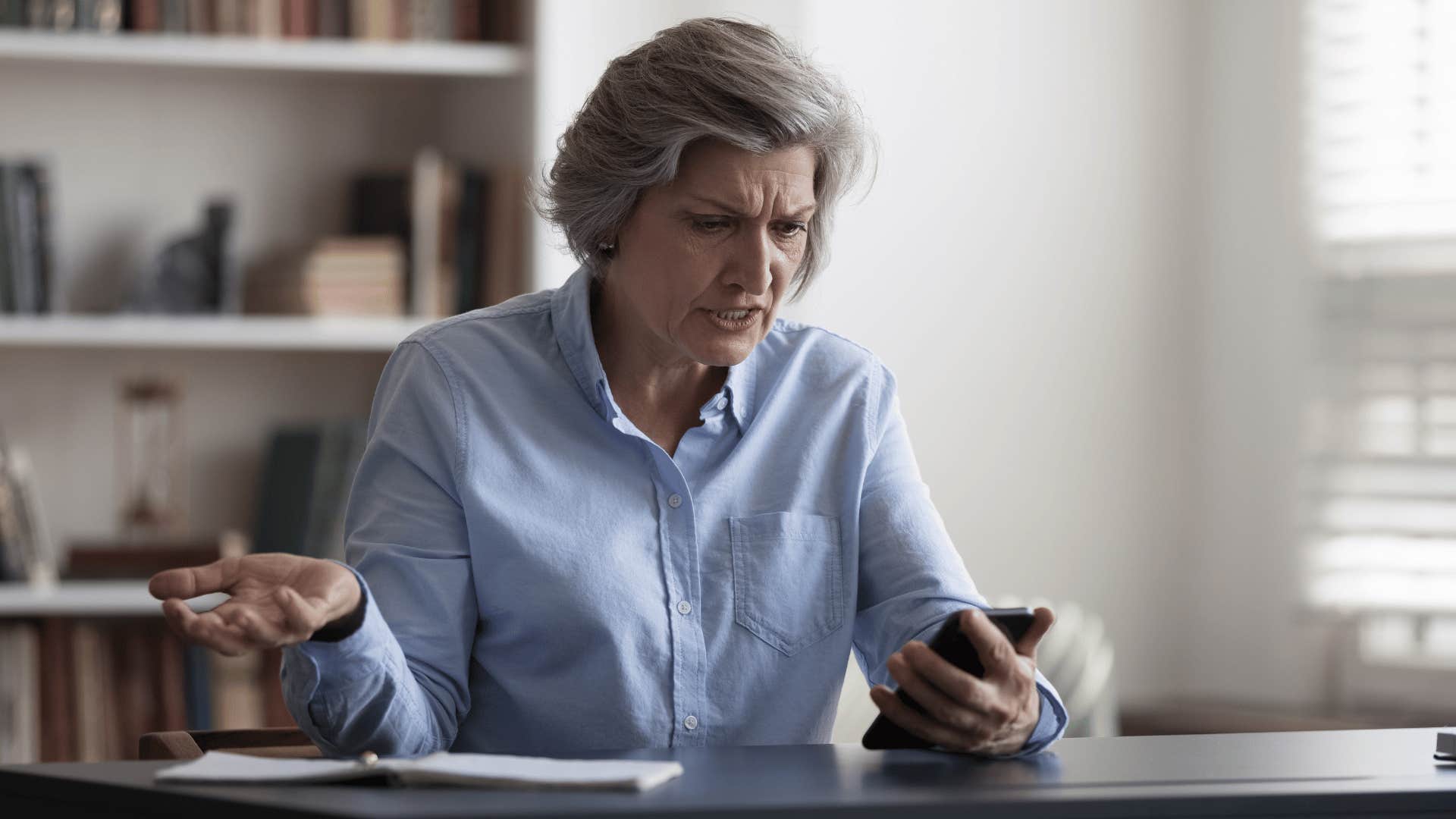 boomer complains about phone while staring at phone upset