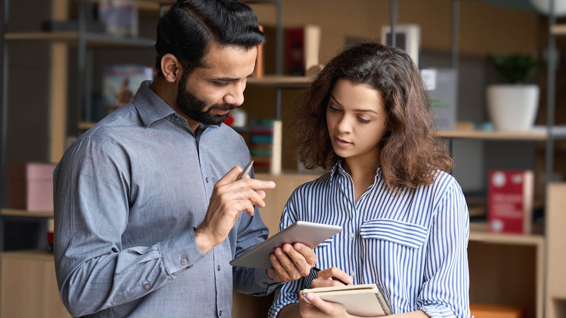 man asking co-worker for help with math