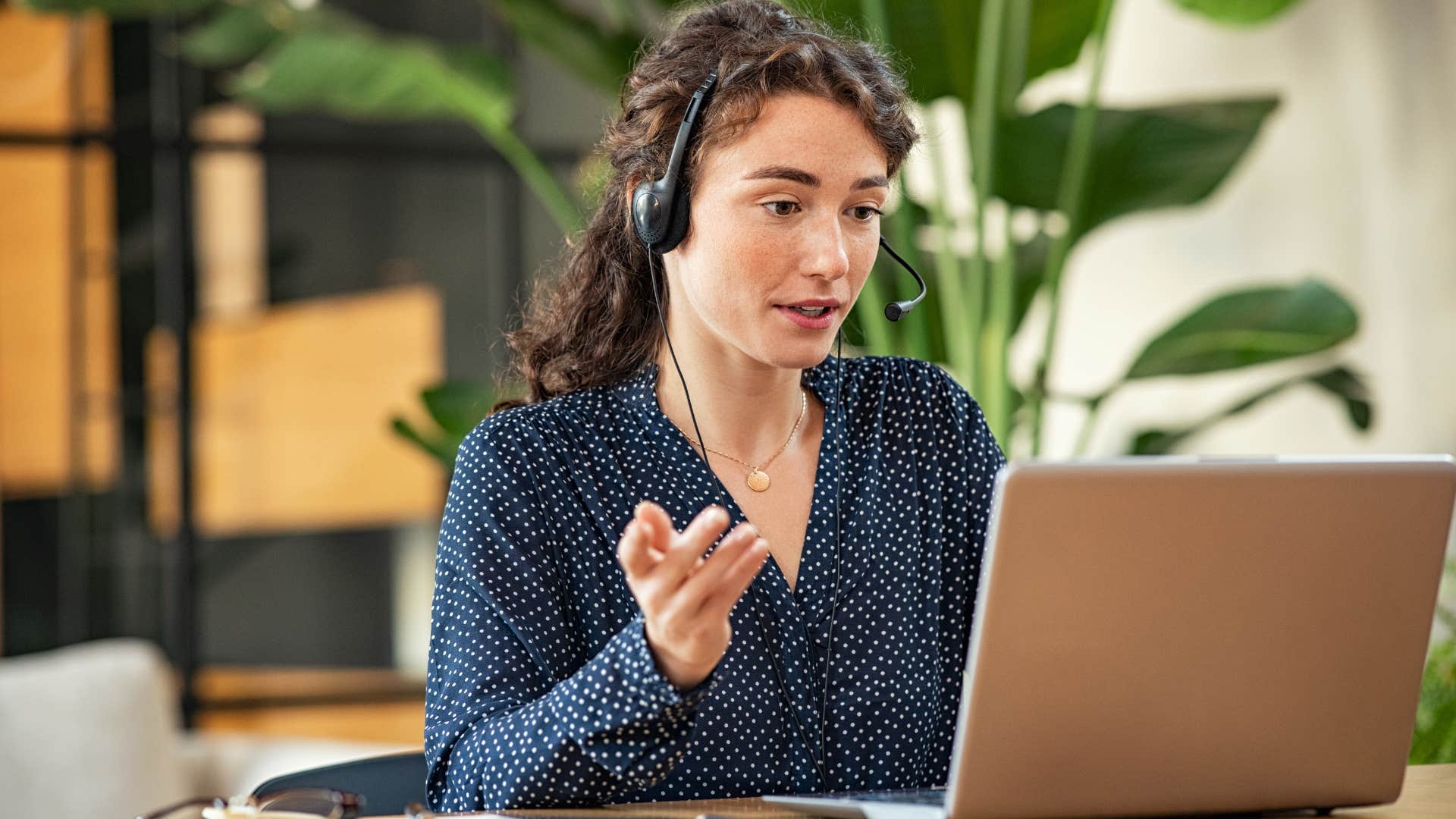 woman on headset having serious conversation