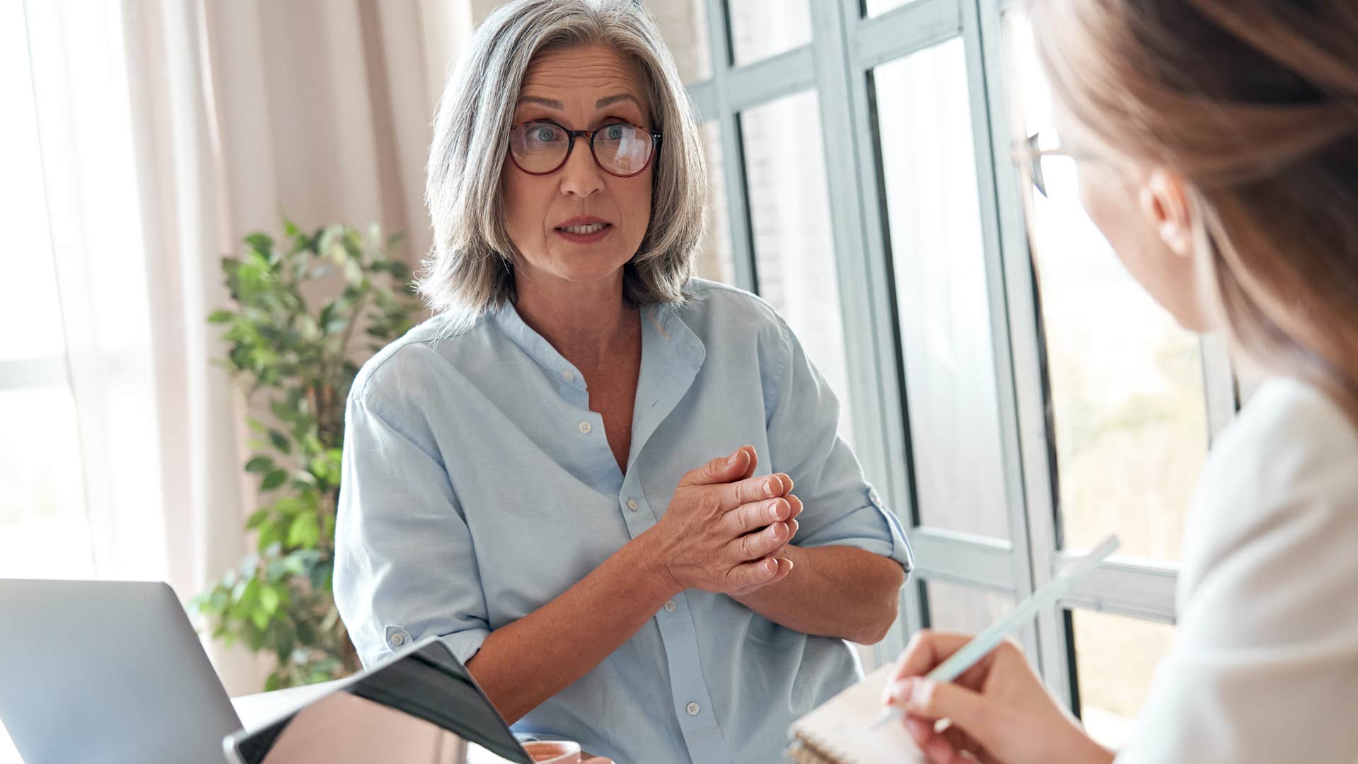 older woman speaking with superior