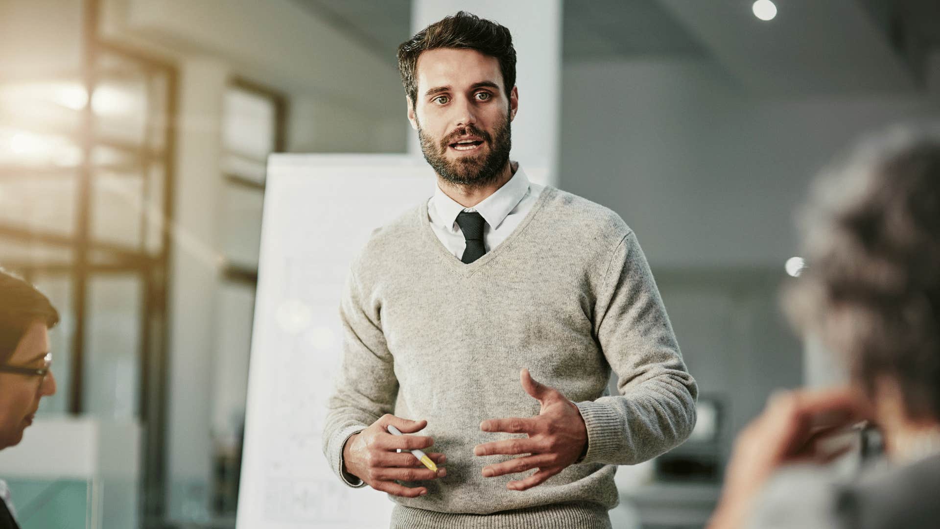 employee giving presentation to colleagues