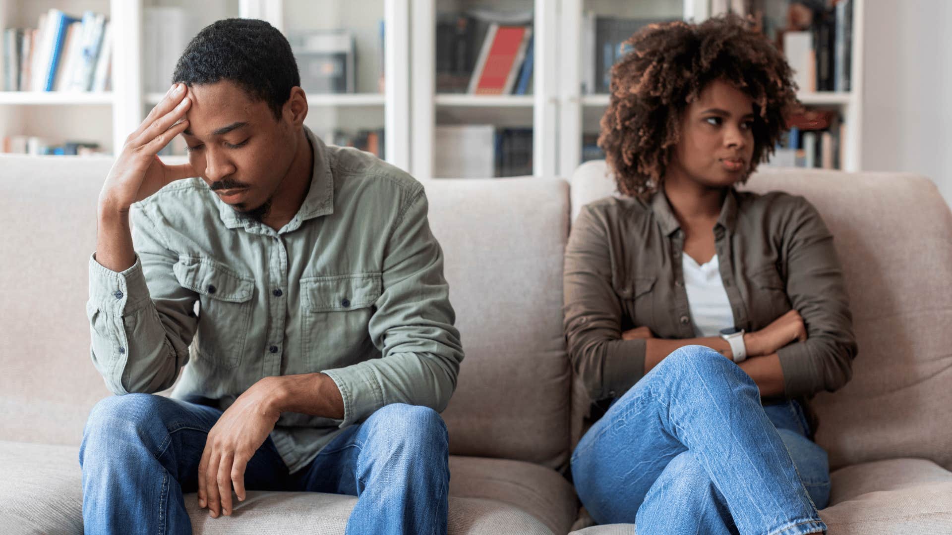 unhappy couples on couch