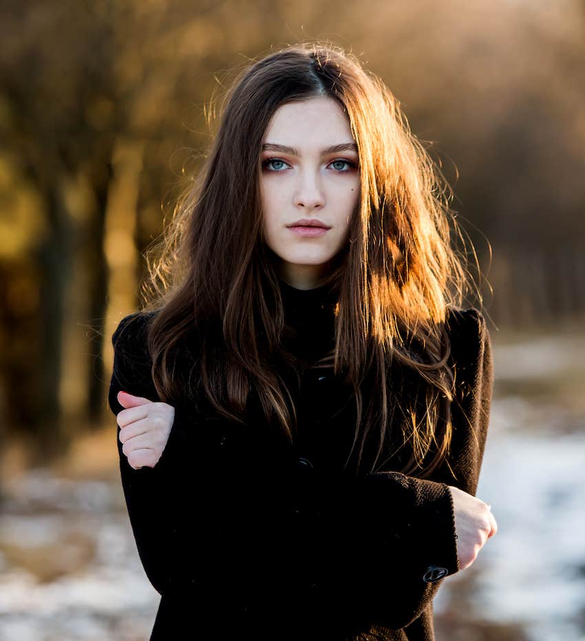 Serious woman randomly showed up on a path in the park