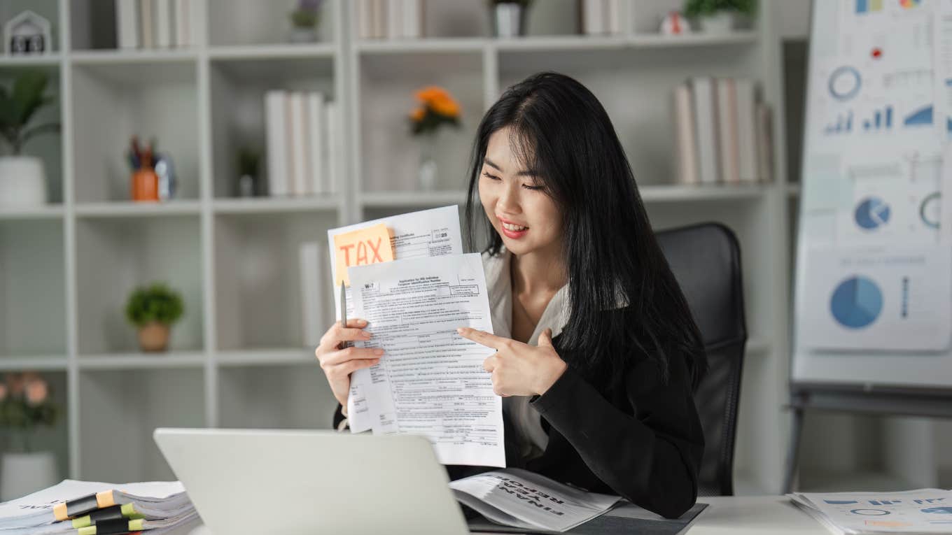 A woman filing her taxes which reveals a lot about her personality