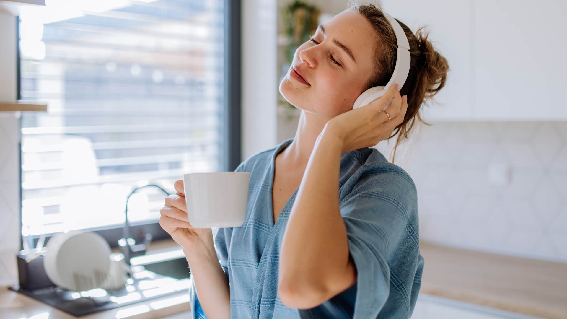 happy woman listening to music alone