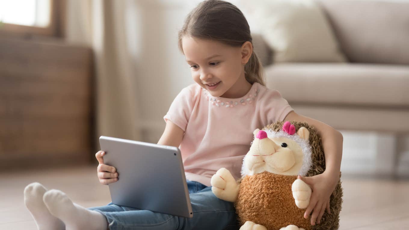 Little girl engaging in banned screen time