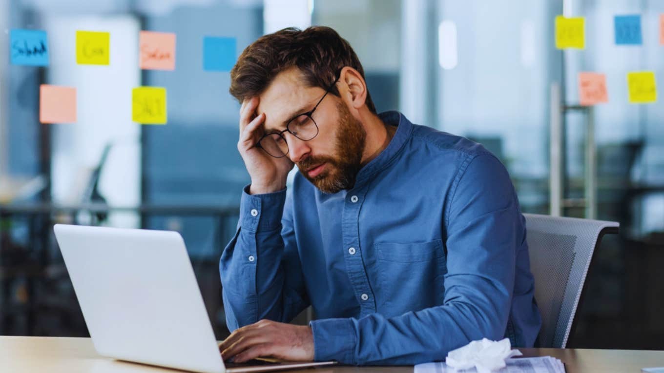 man stressed at toxic job 