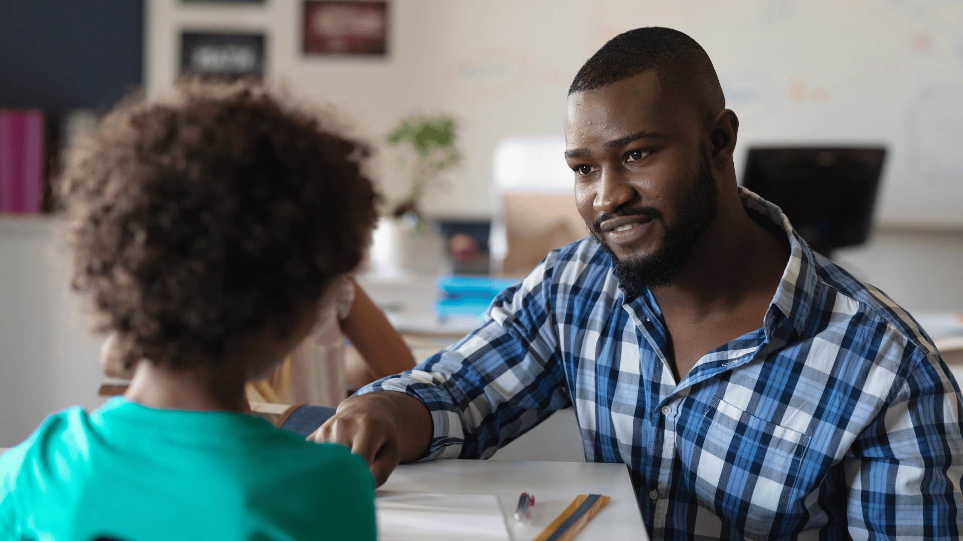 teacher talking to student