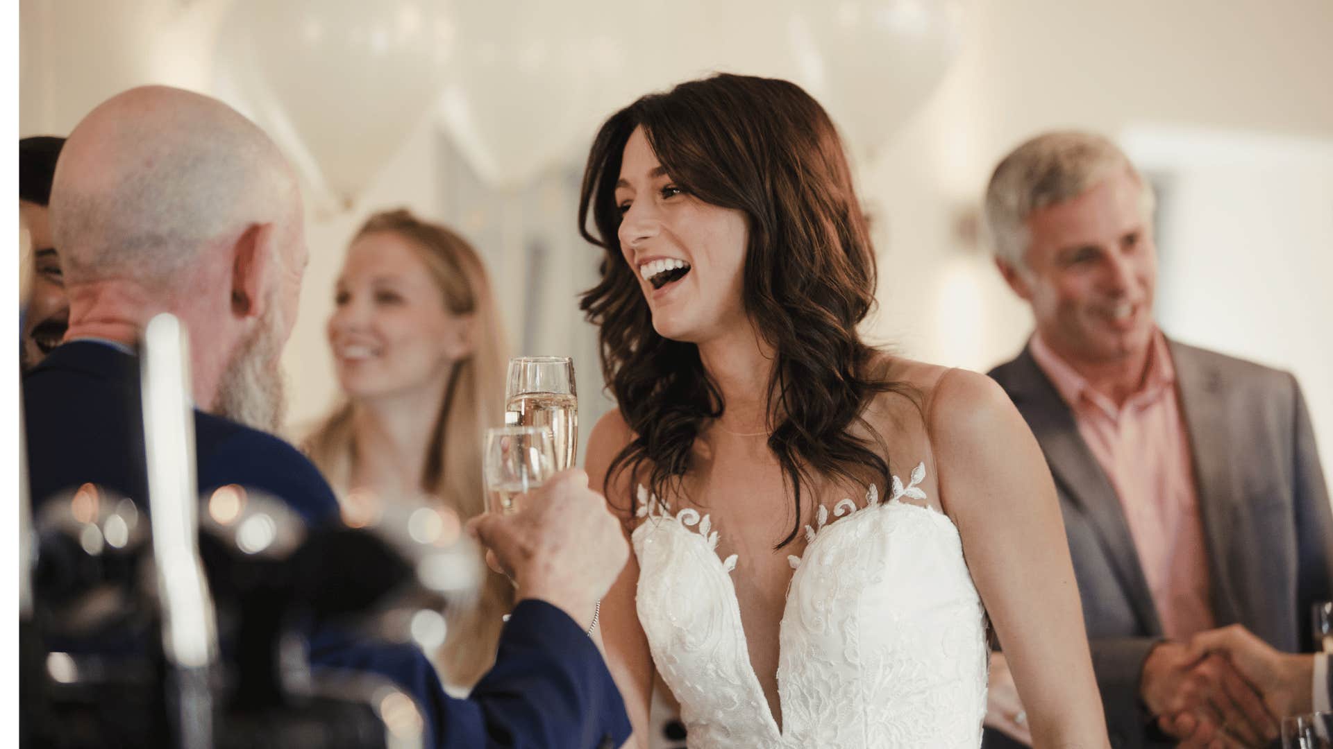 Smiling bride declines father daughter dance