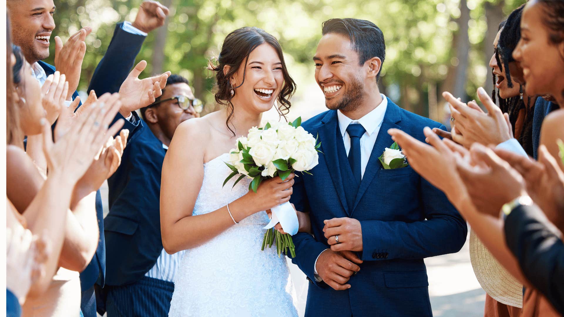 Bride and groom walk line of guests after wedding ceremony