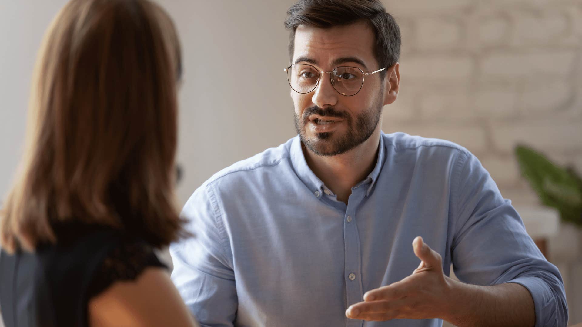 man talking to woman