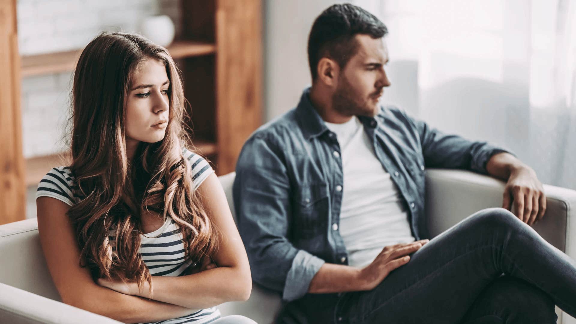 upset woman with no close relationships sitting next to man