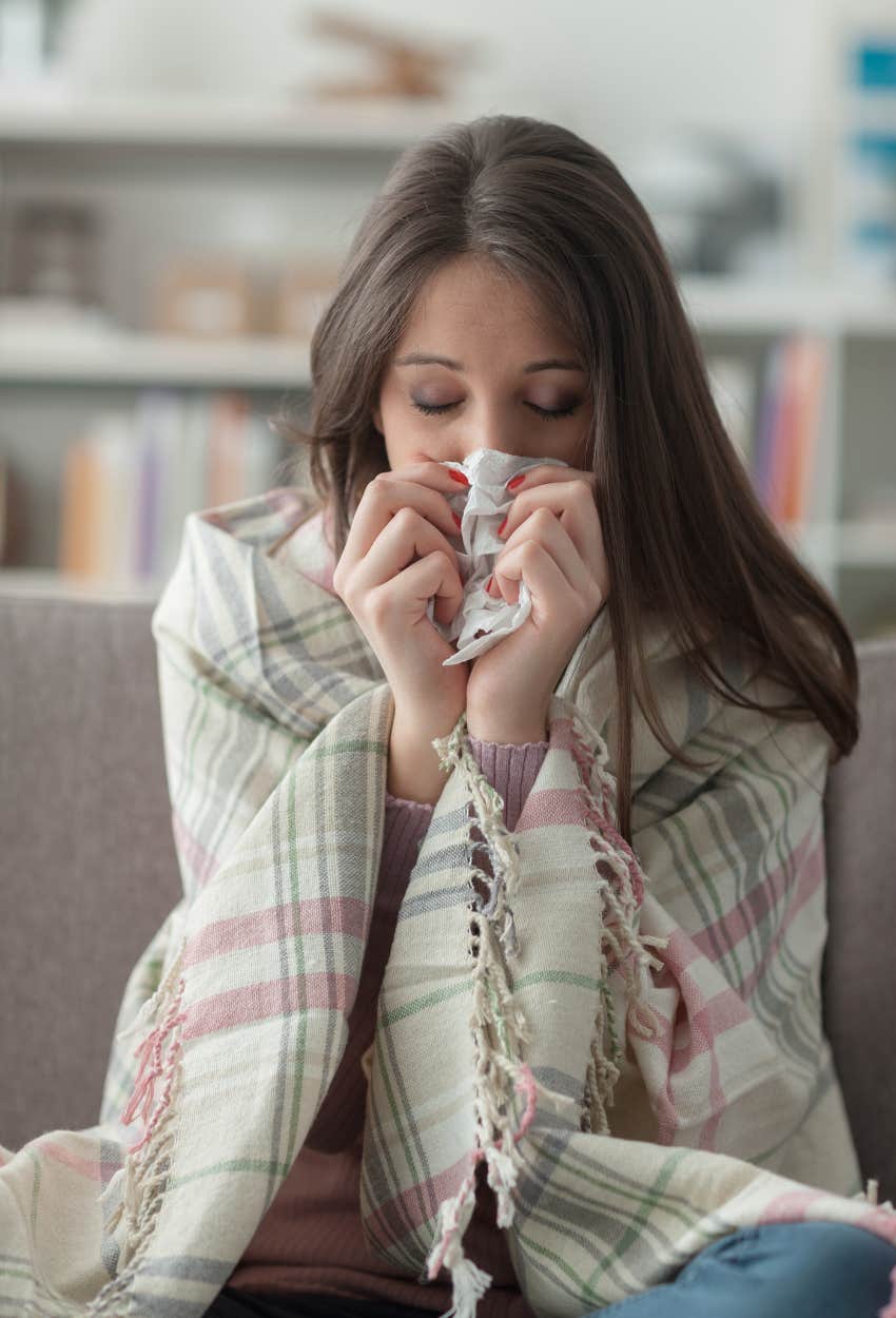 Woman with a cold who should stay home instead of going to the ER