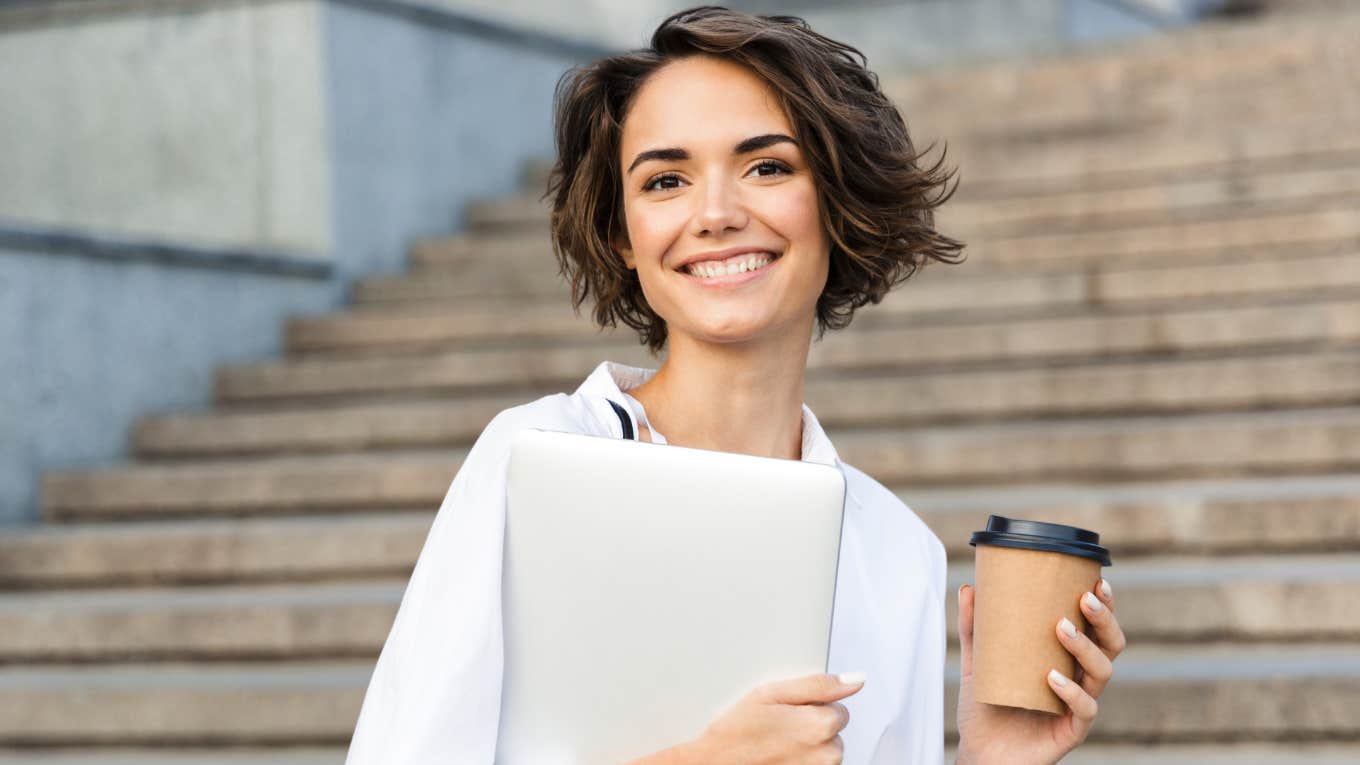 Young woman with laptop practicing hot girl habits for a better life