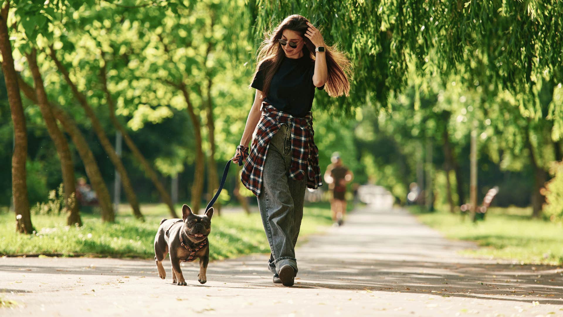 woman showing leadership with her dog