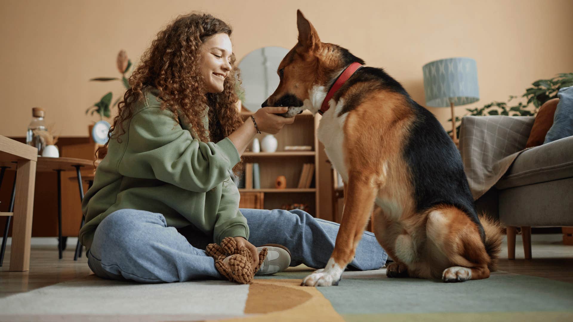 woman being patient with her dog