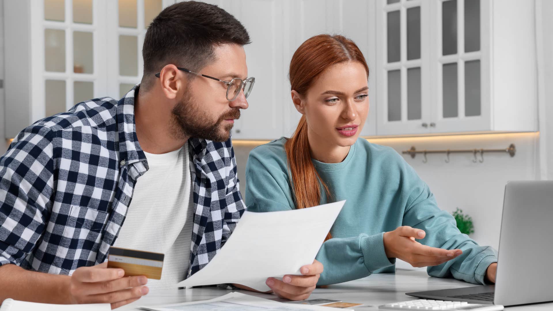 Gen Z couple checking their bank statement