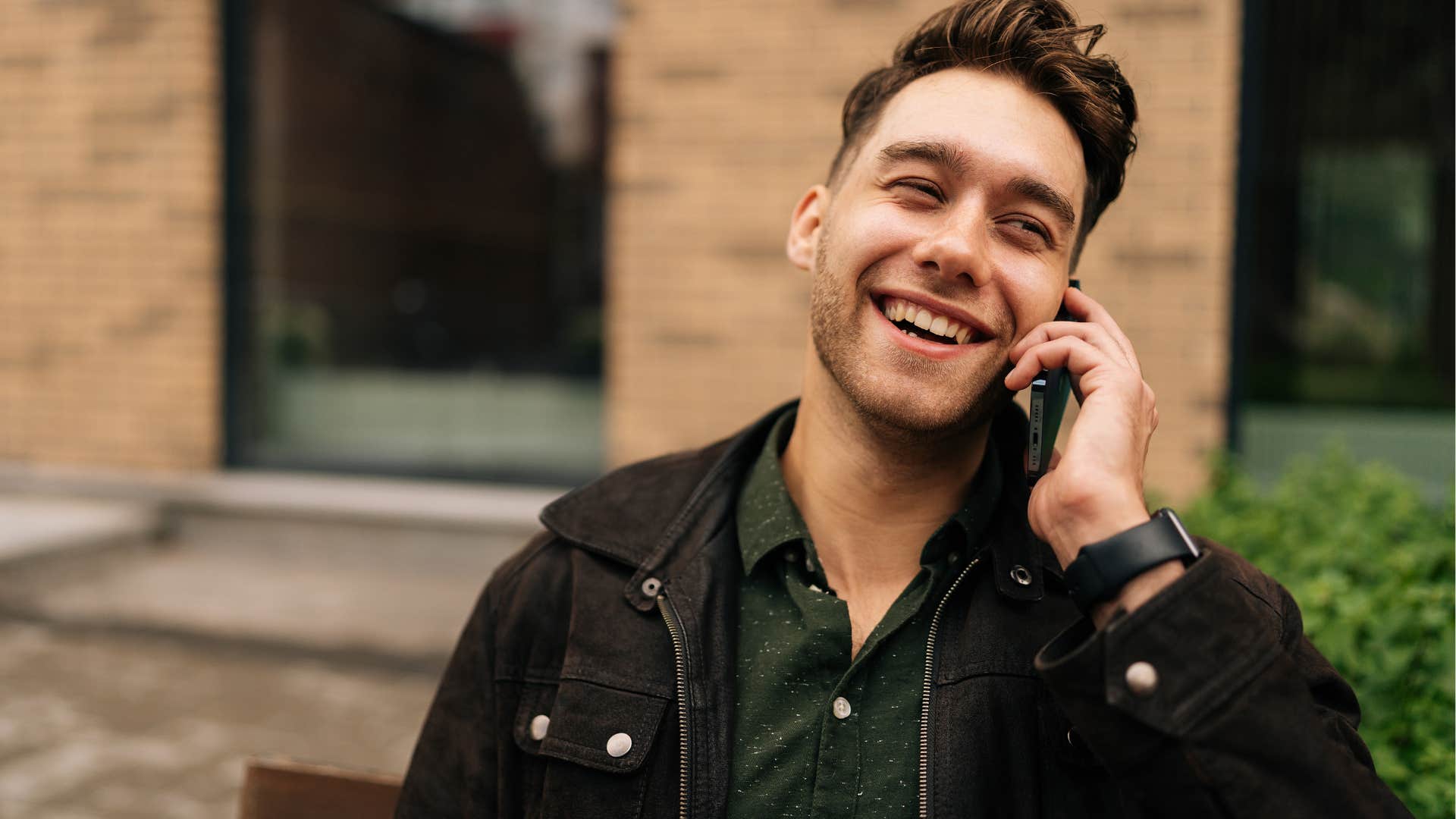 Young man smiling and talking on the phone