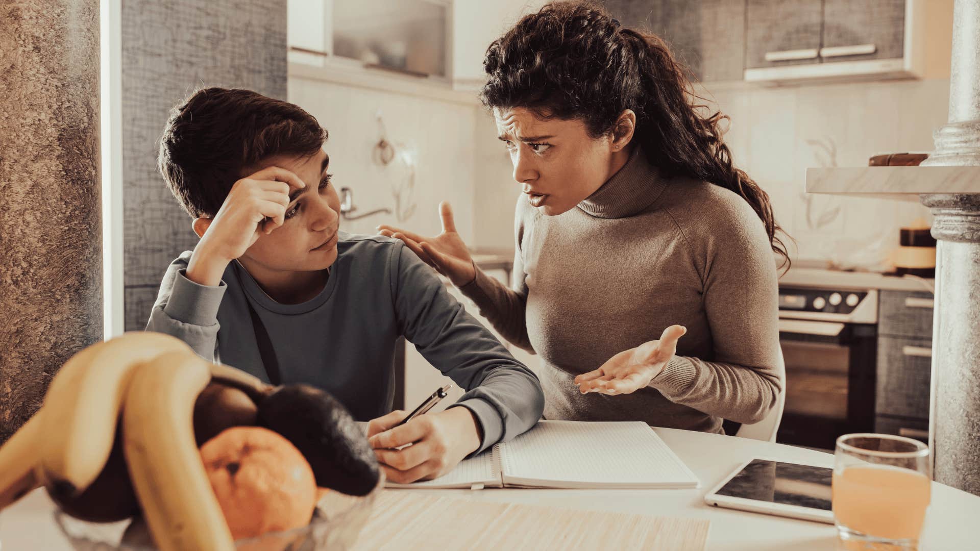 mother yelling at son doing homework