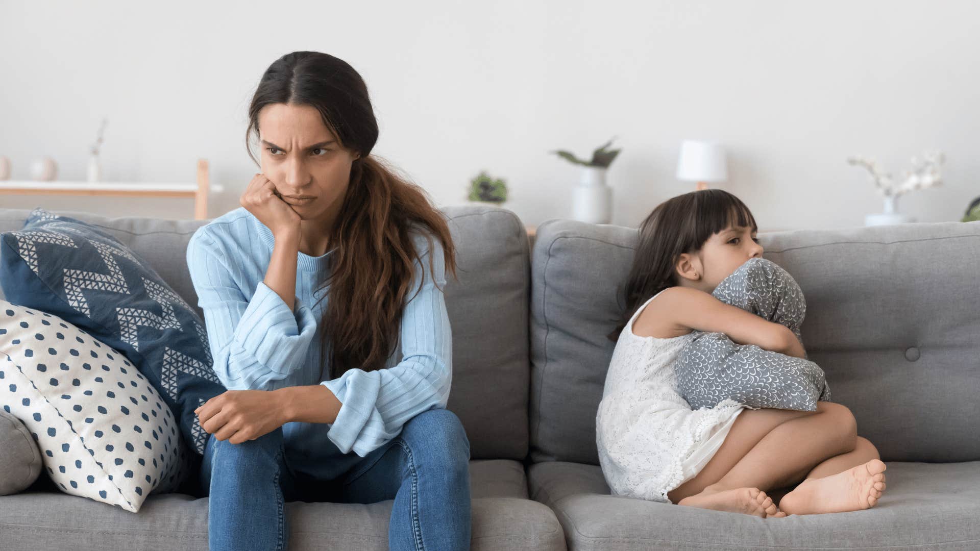 mother and daughter on couch not talking