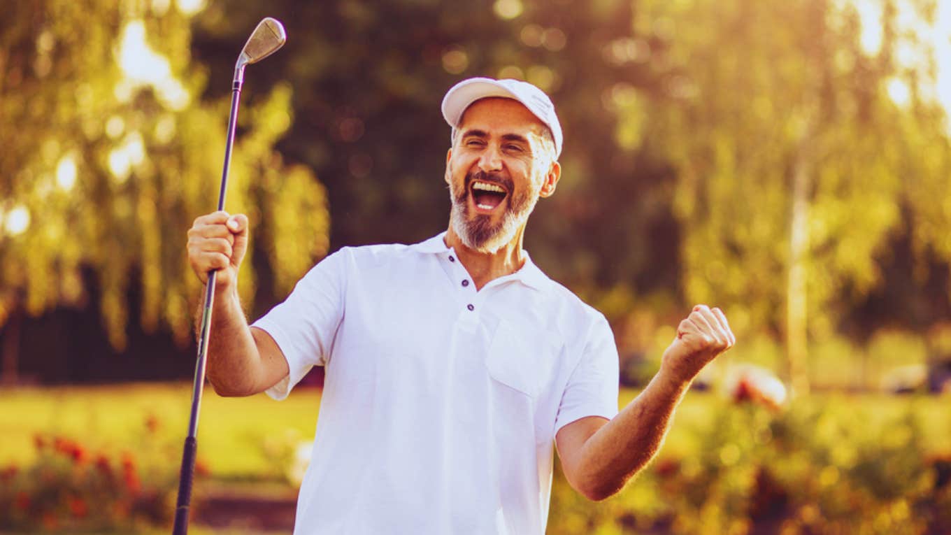 happy man golfing 