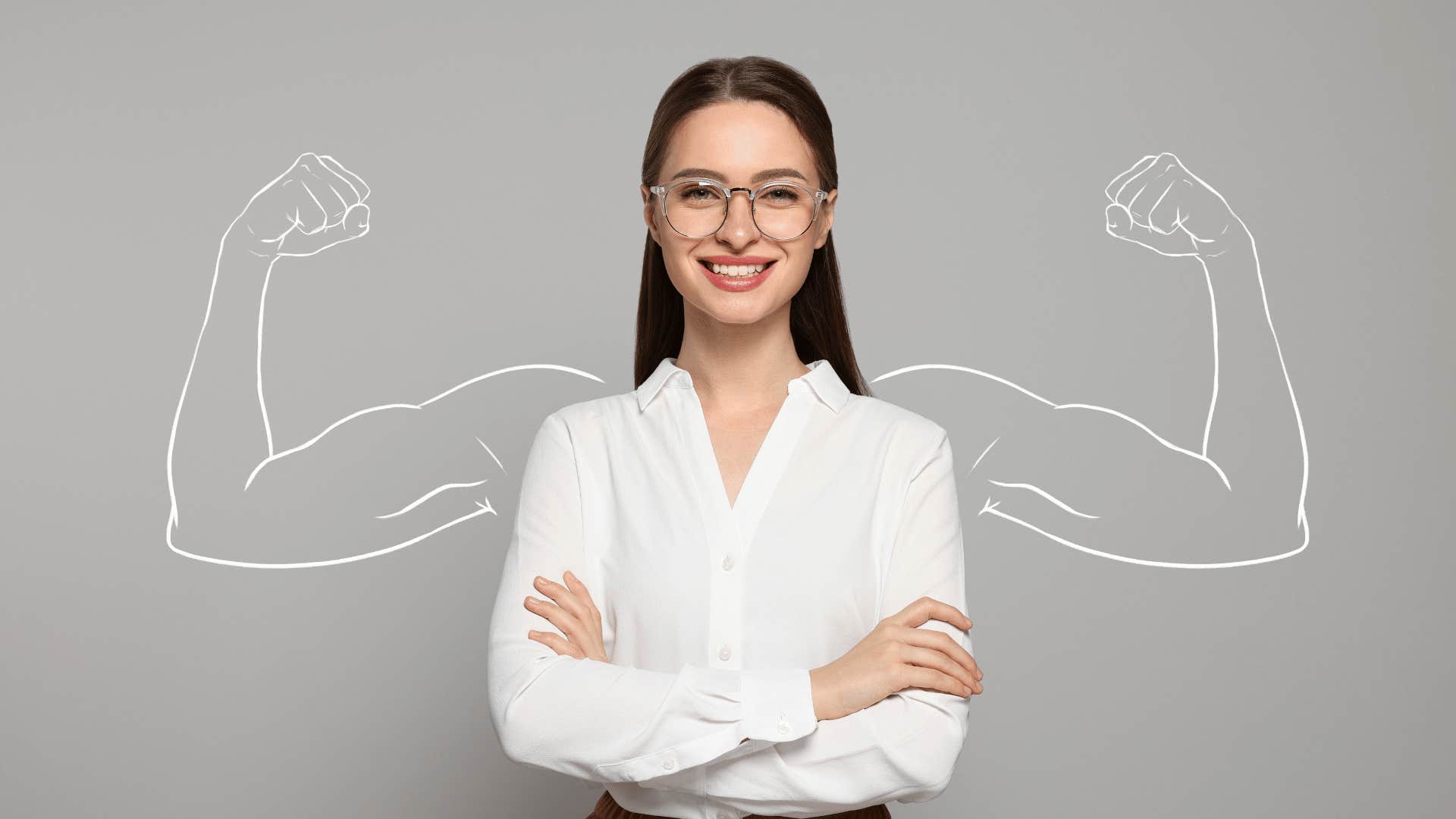 woman with her arms crossed and chalk drawing of strong arms behind her