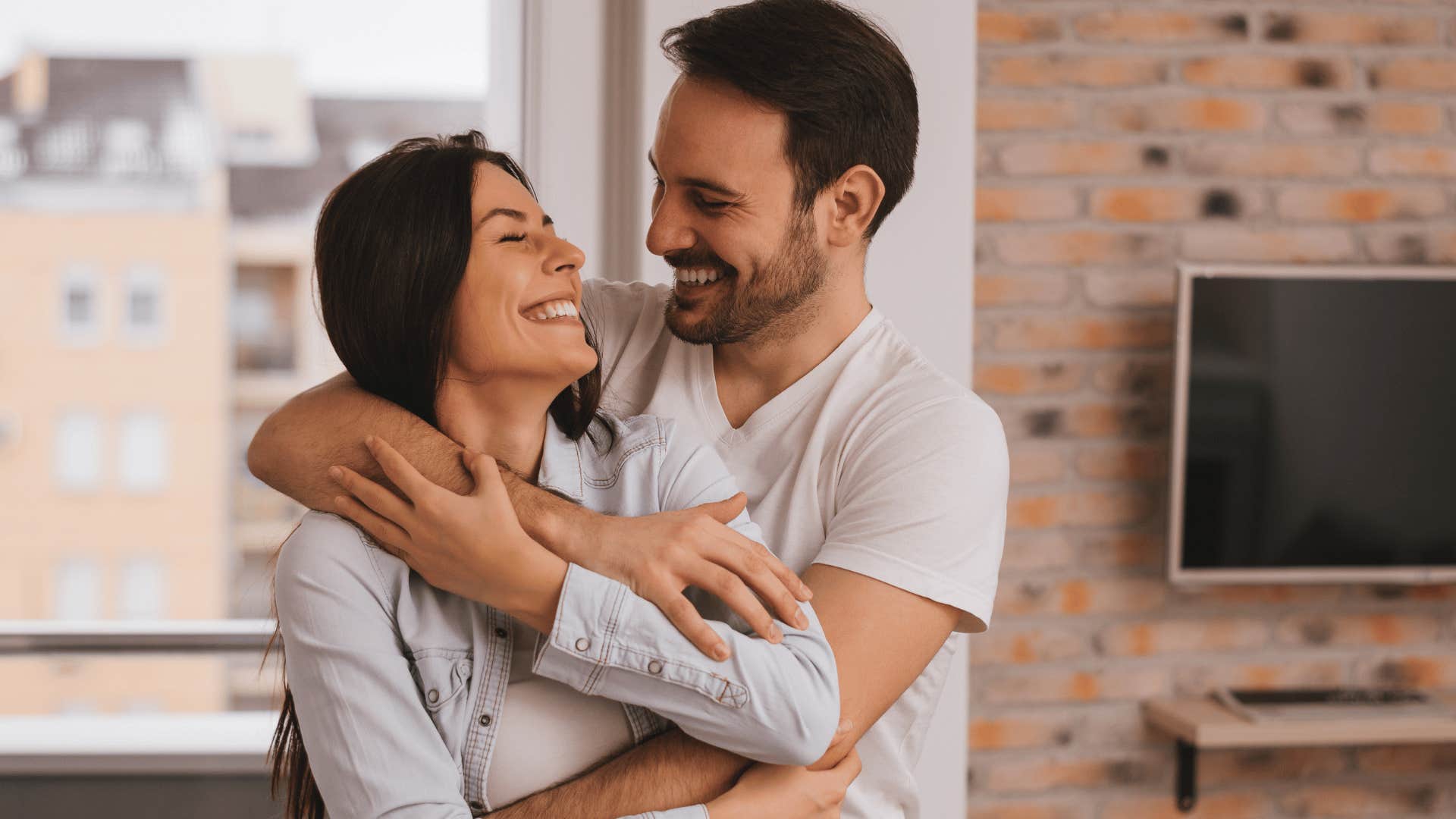 couple hugging and smiling