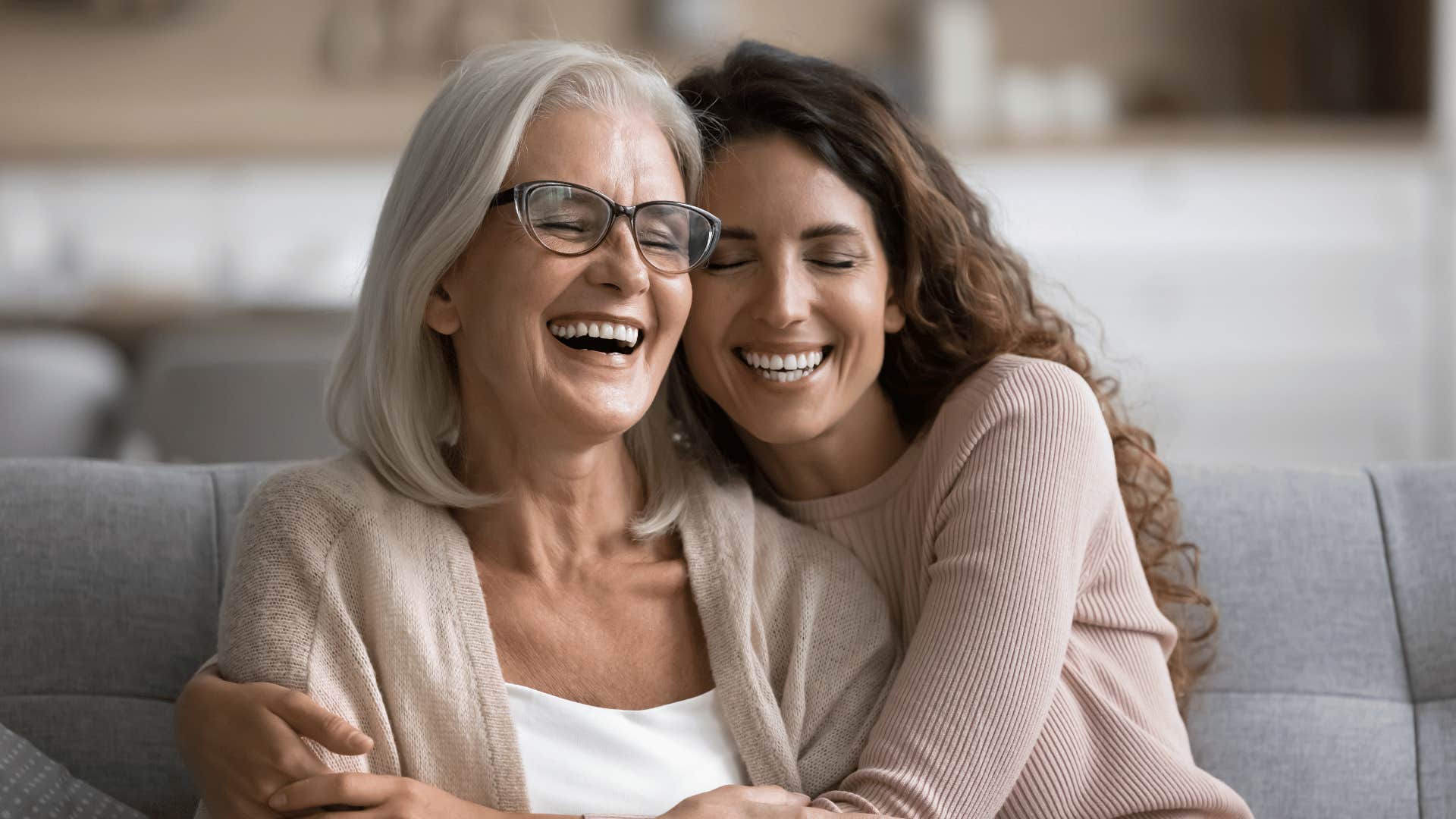 woman hugging her mother who is her comfortable parent