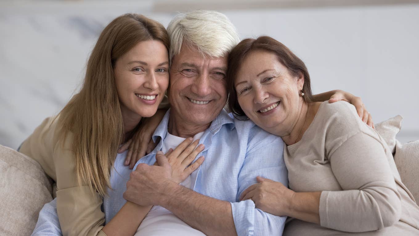 woman hugging her parents who did good job raising her