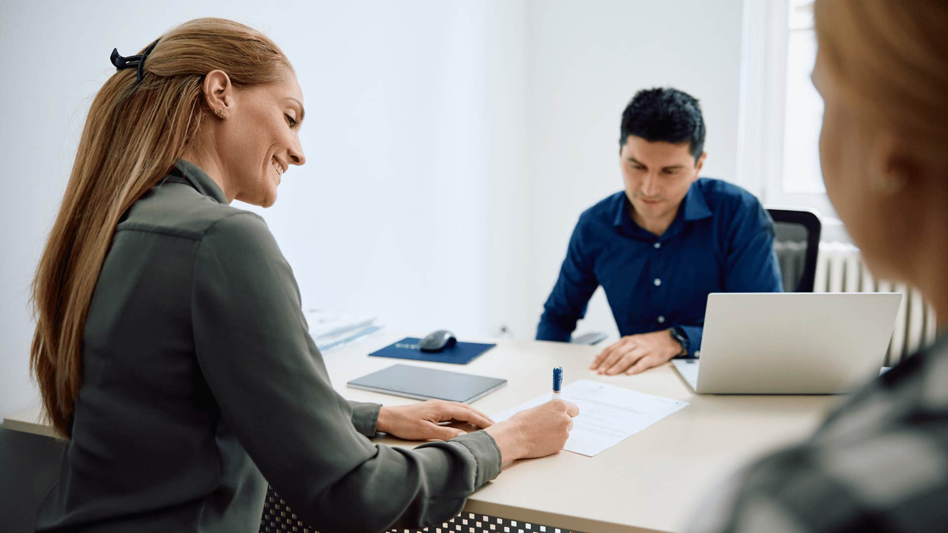 mother filling out forms for daughter