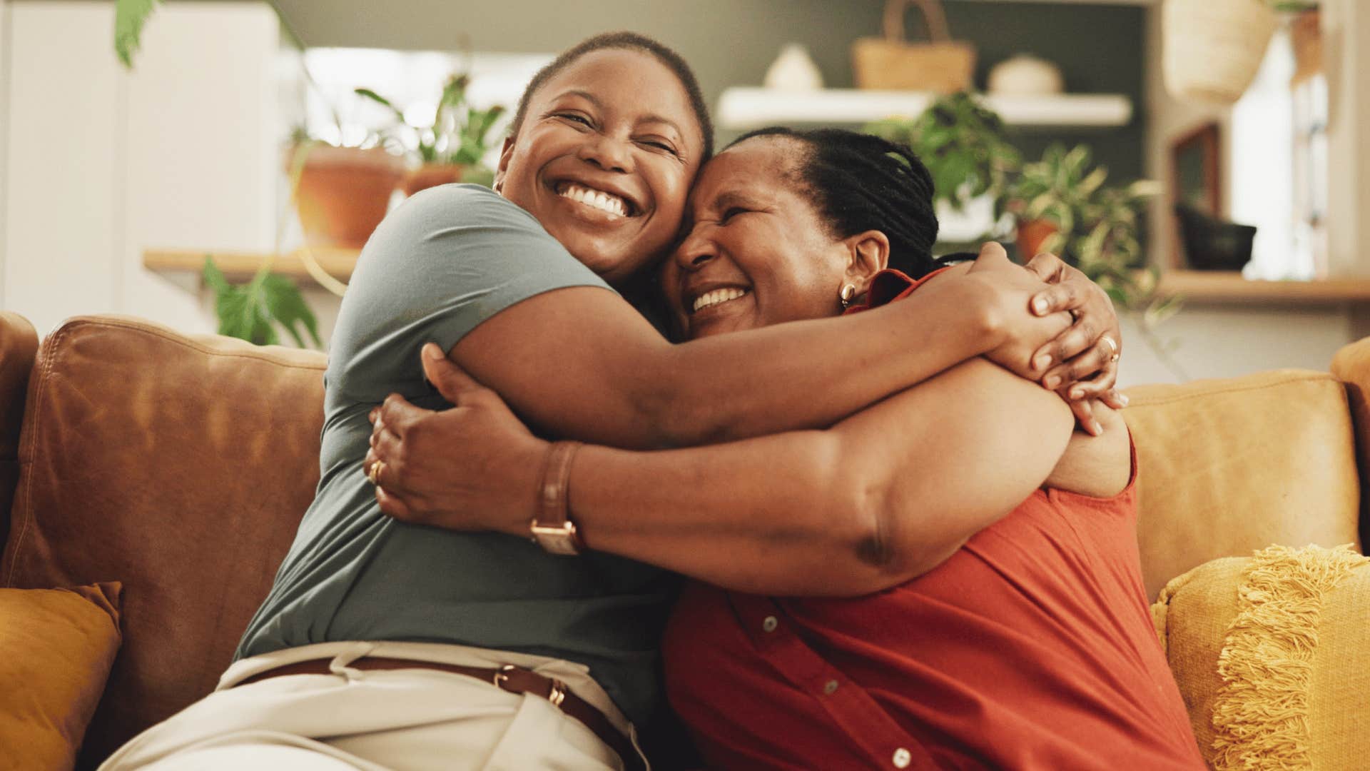 smiling mother and daughter embracing