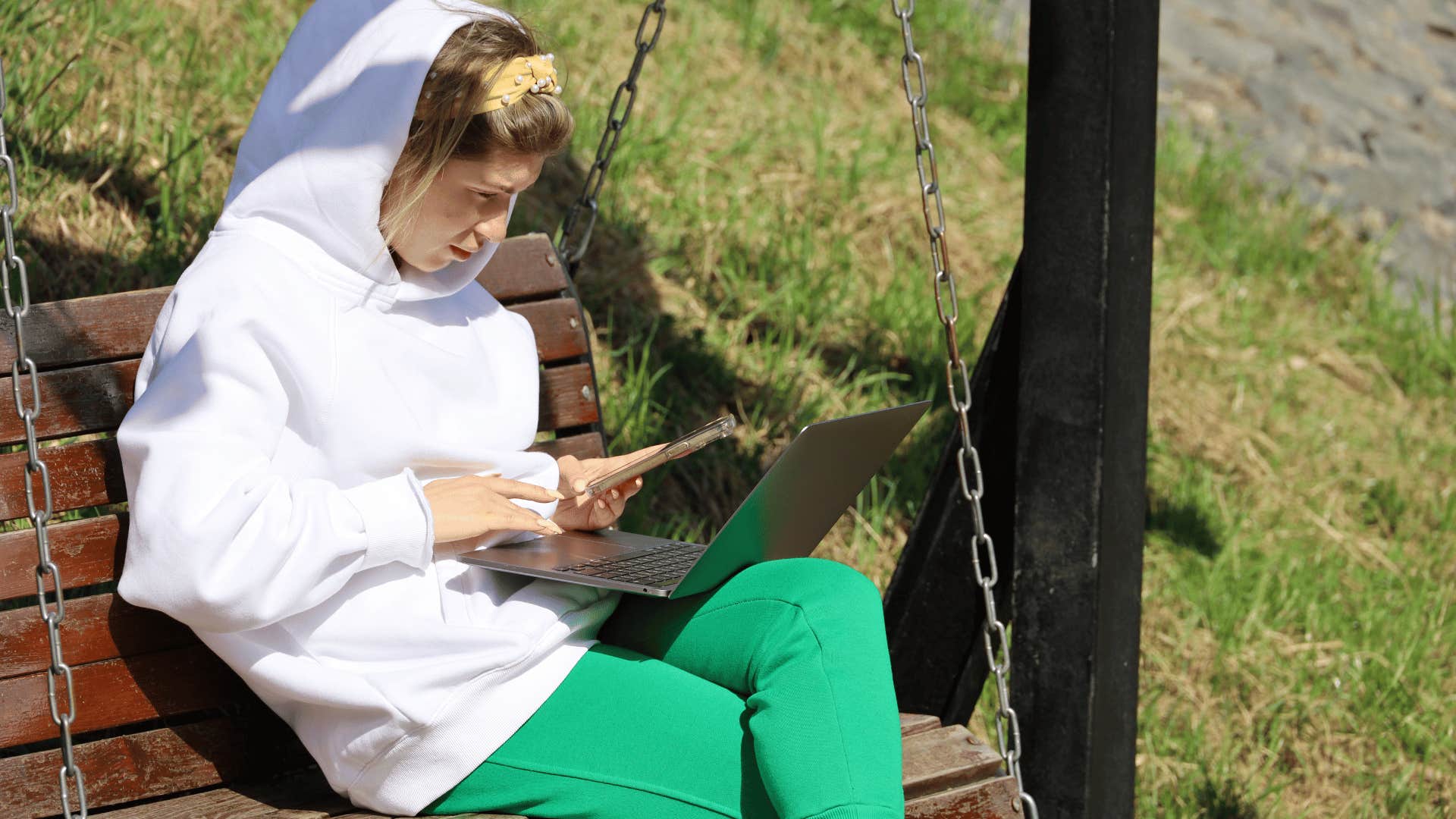 woman working on laptop outside