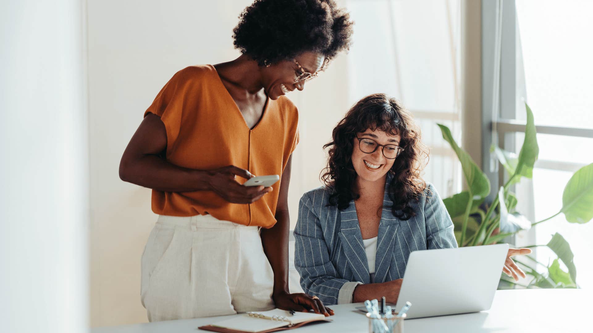 women at work looking at laptop