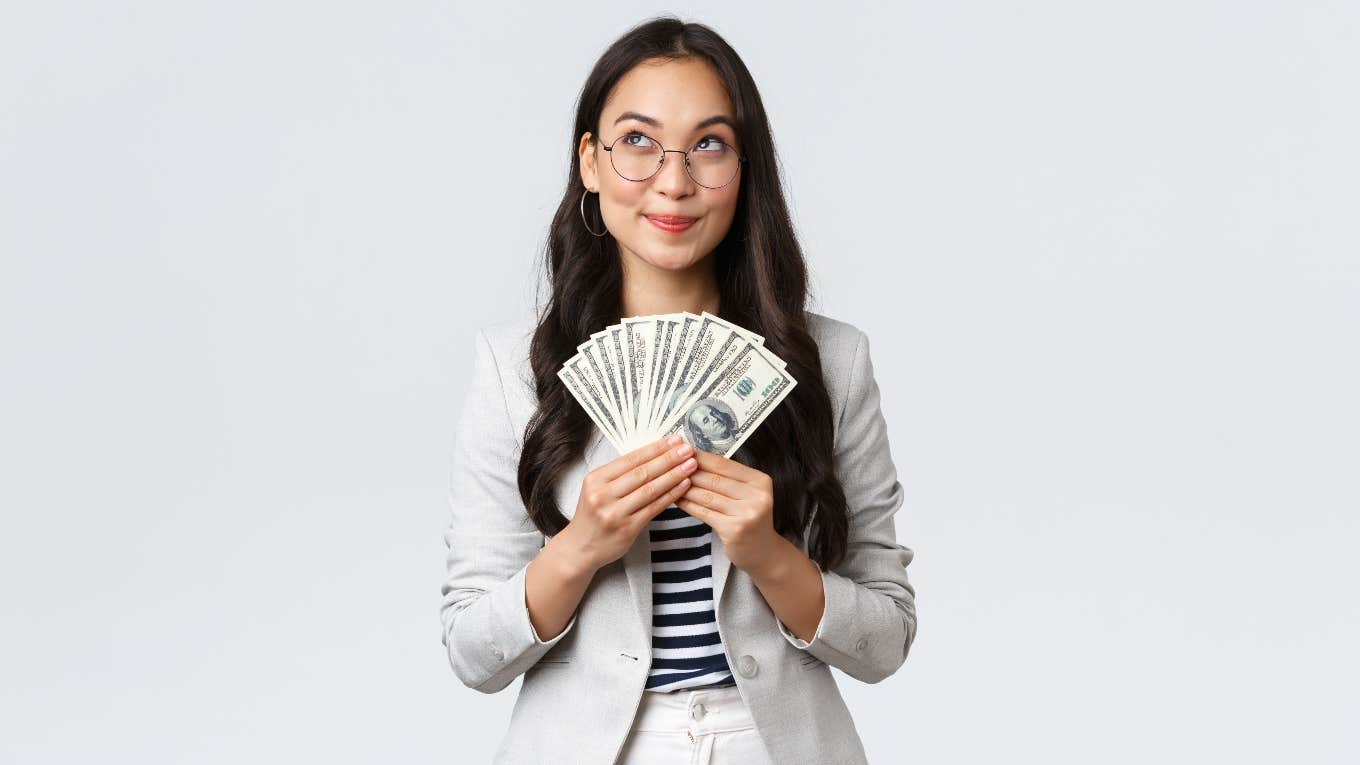 financially responsible woman holding cash