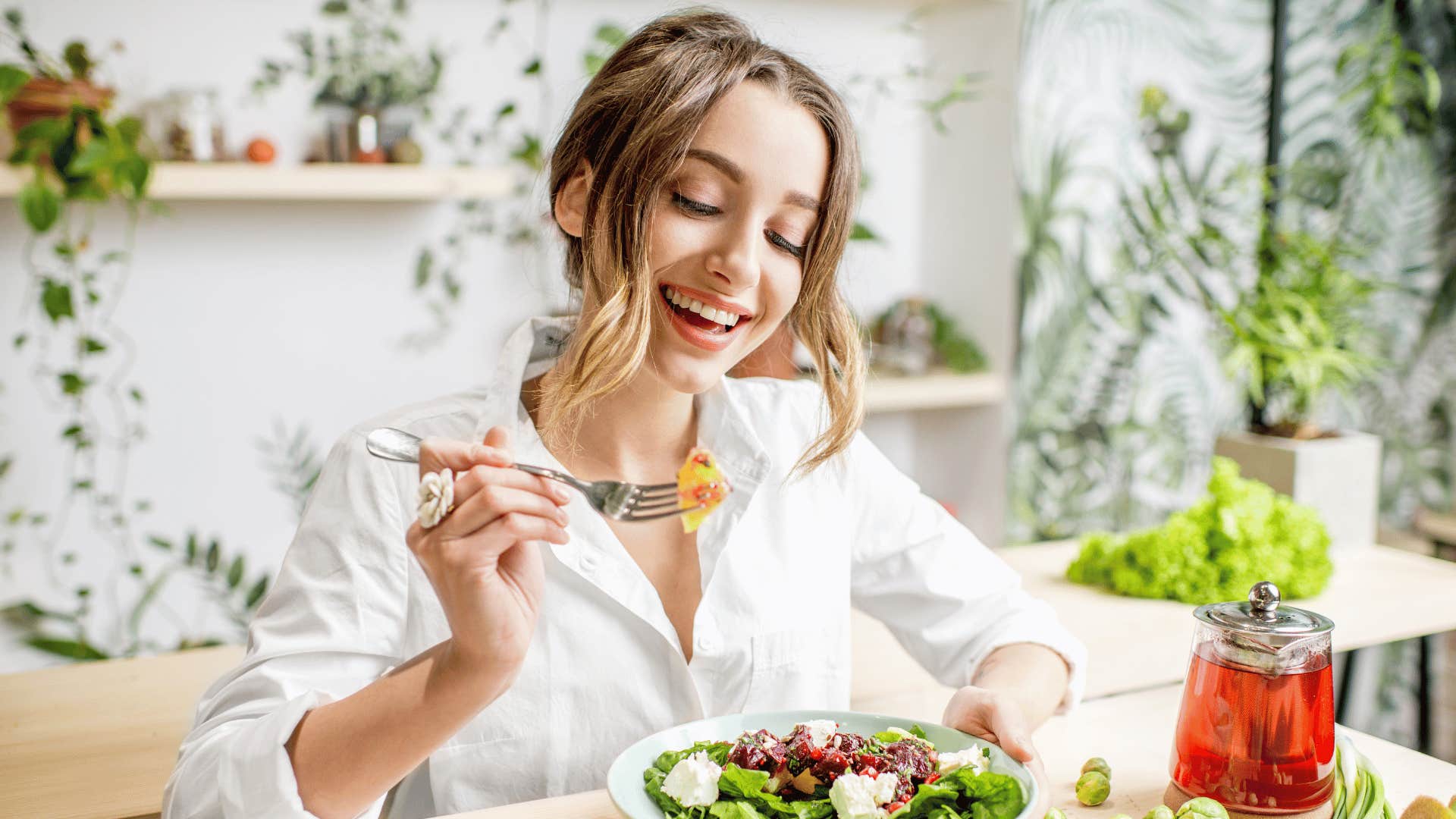 woman eating salad