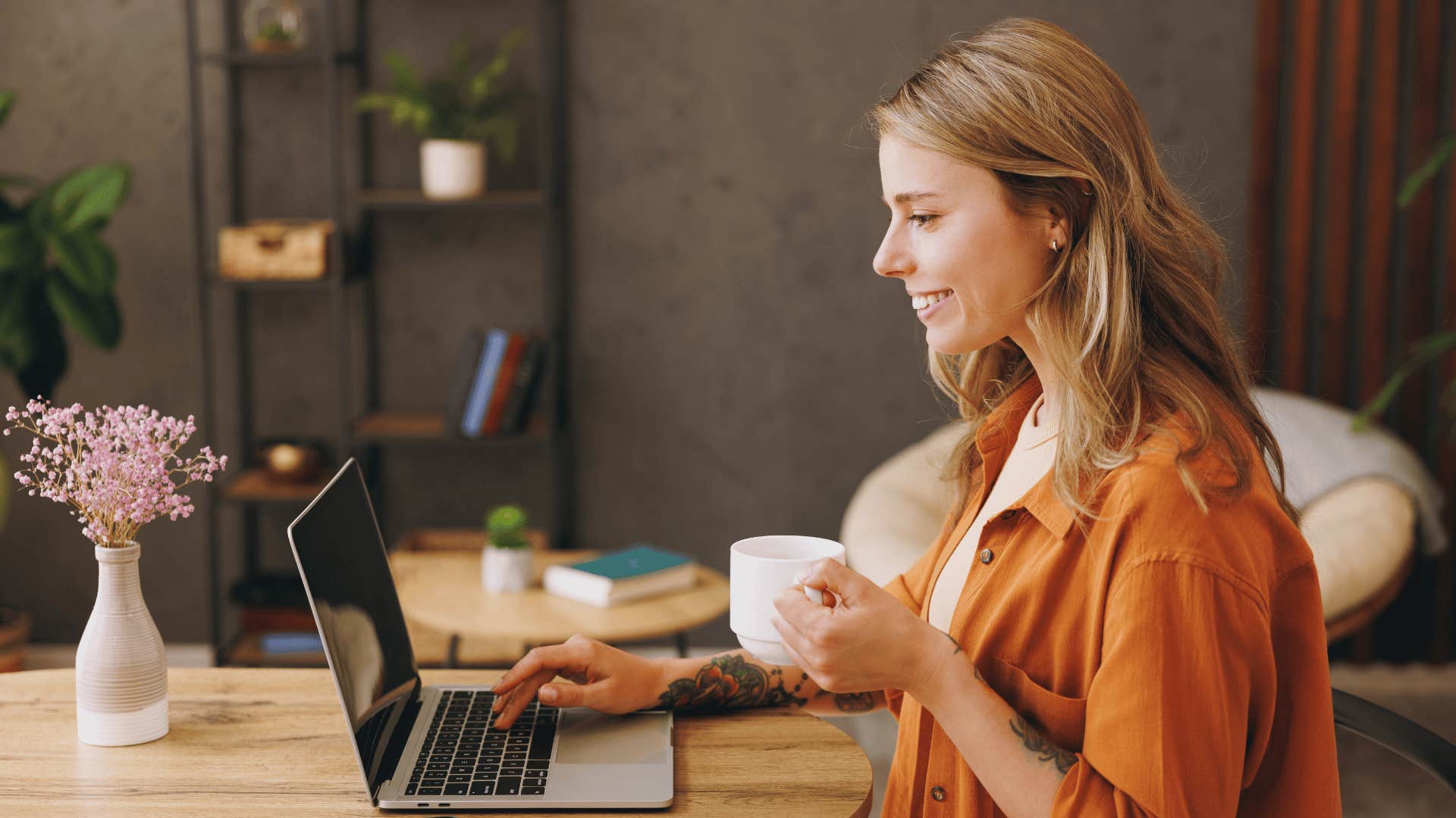 woman writing on laptop