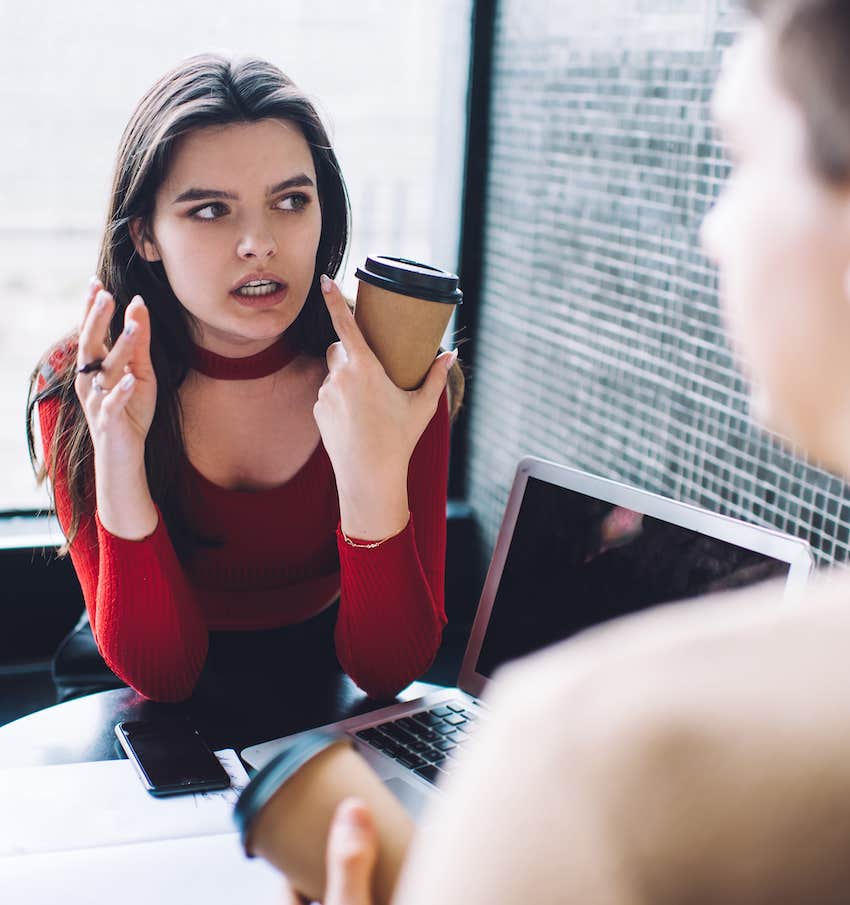 Woman holds coffe and talk to friend all about herself